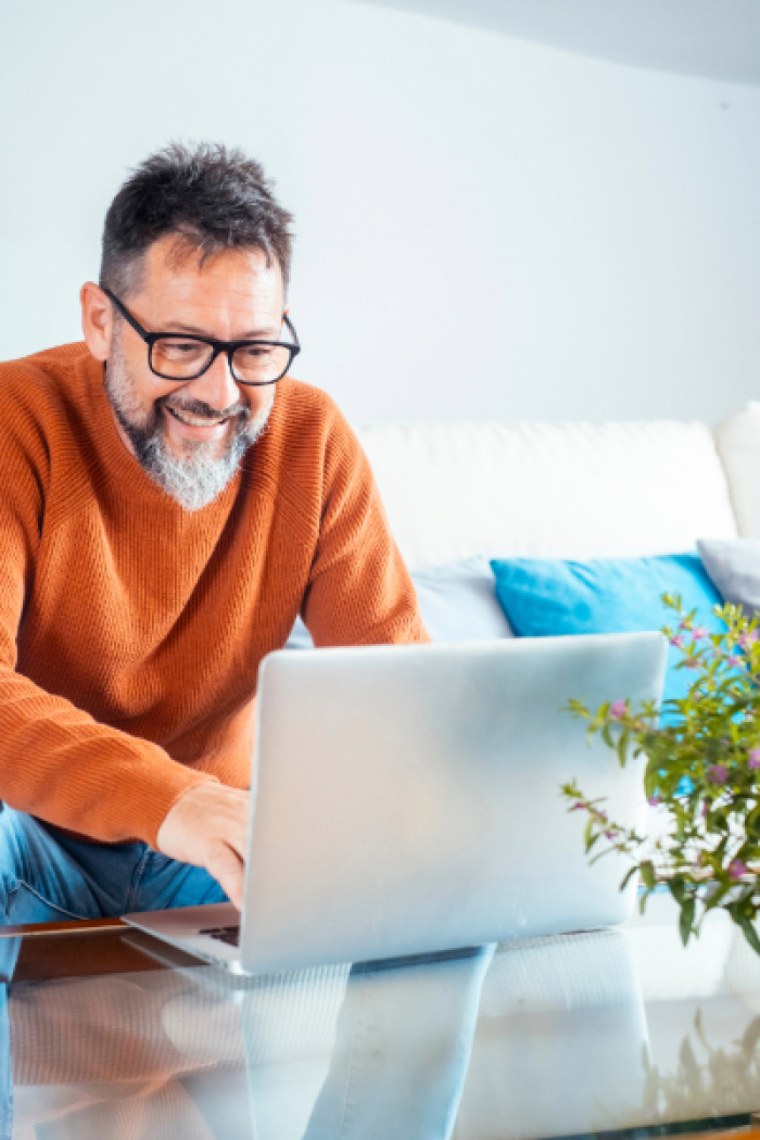 Man reviewing his eStatement on computer