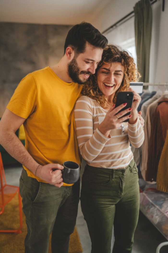 Couple celebrating their cash back rewards