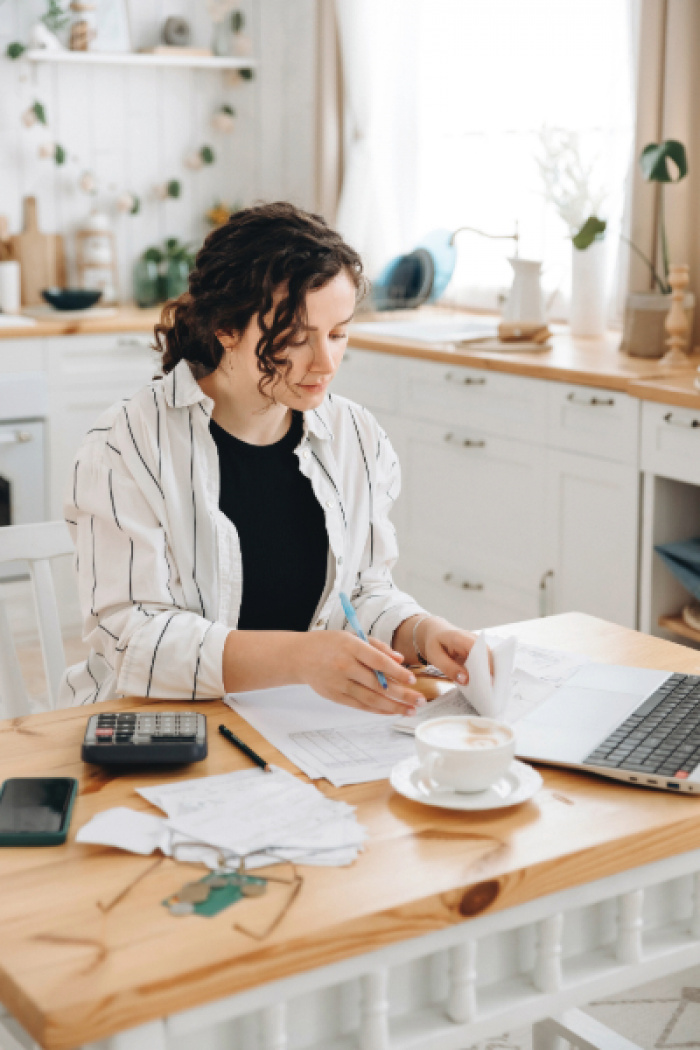 Young woman budgeting her finances