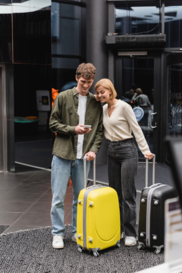 Young couple turning on travel notifications