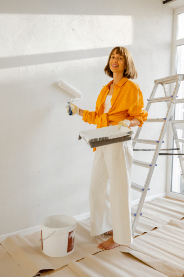 Homeowner painting home