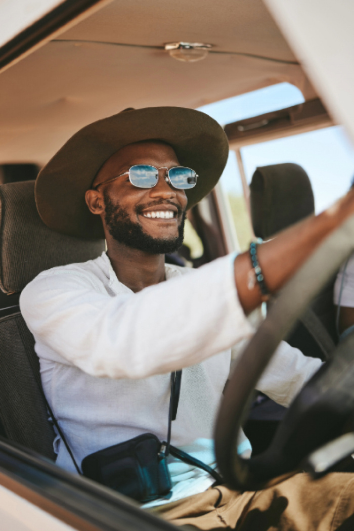 Young man driving car