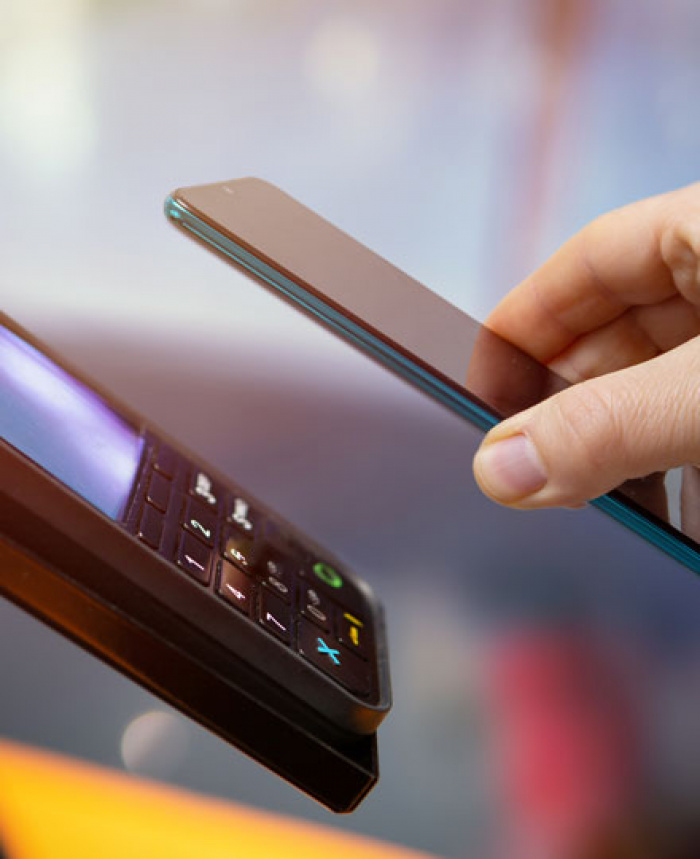 Member using their mobile phone to pay